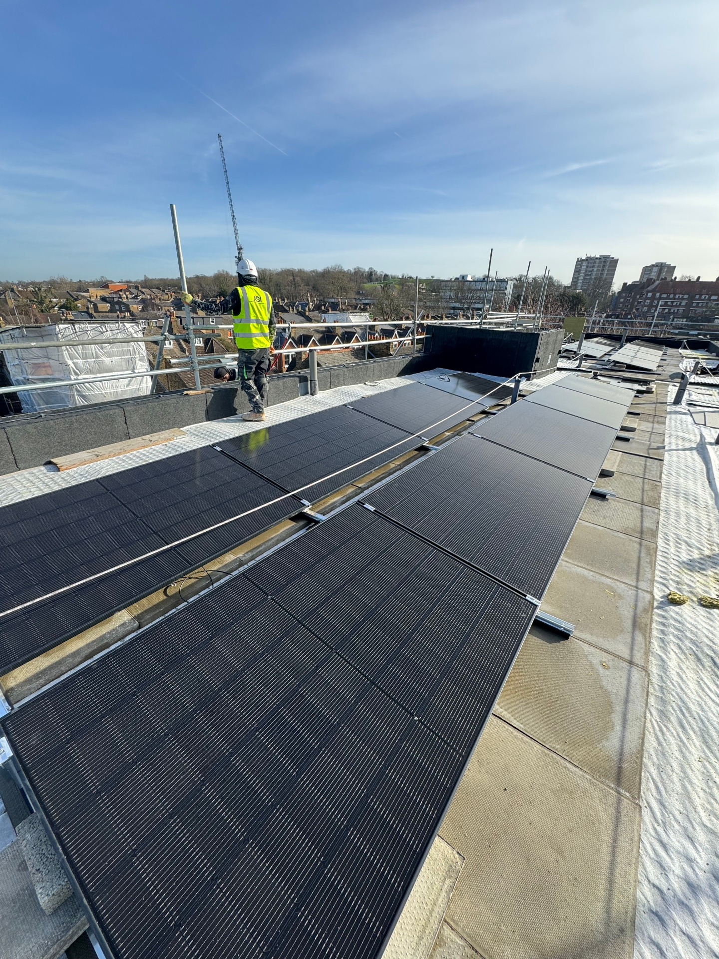Flat-roof solar PV array install on a London new build