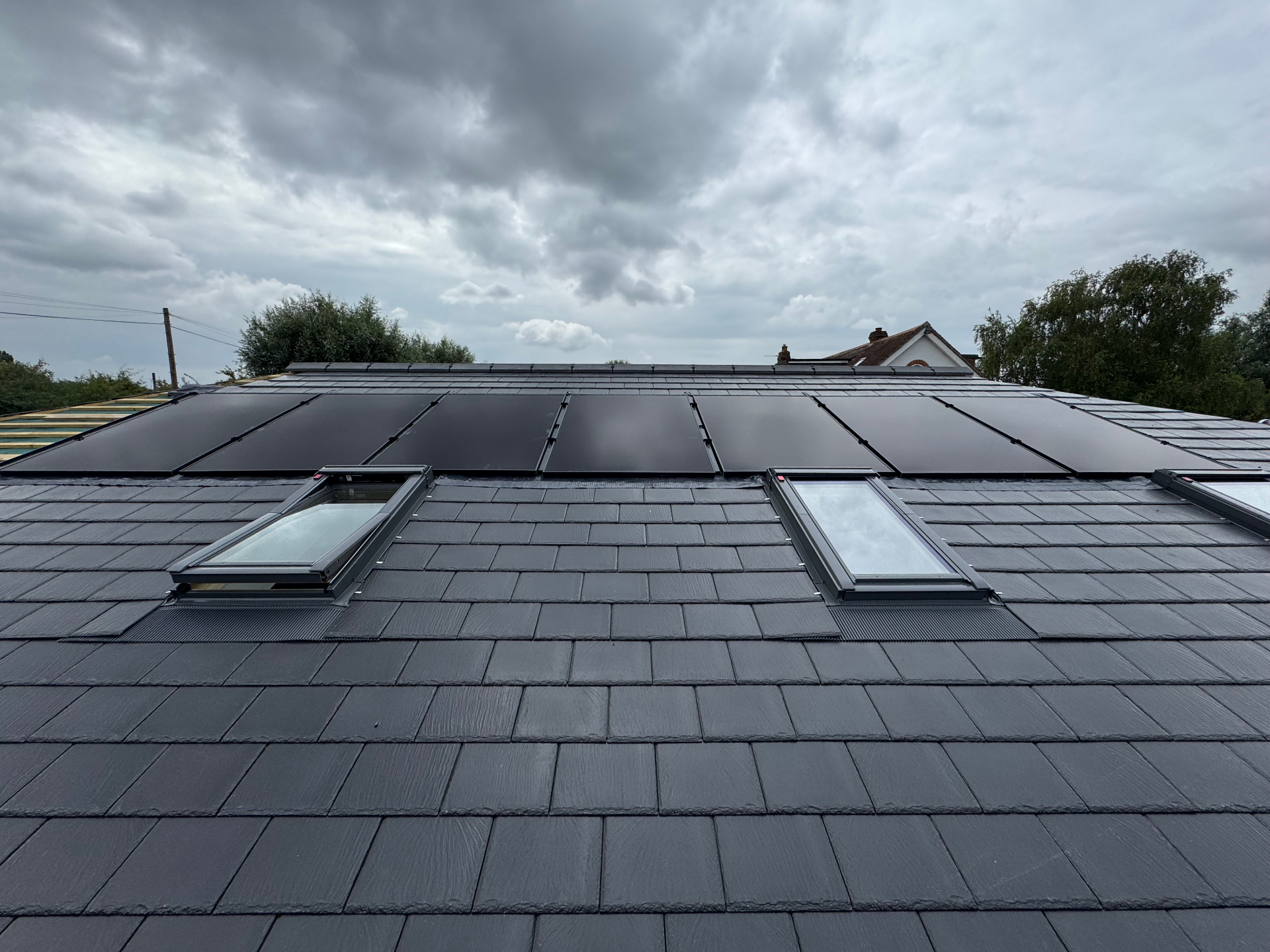 Integrated black solar array on slate roof. — solar PV installation in Chertsey by Solid Electrical