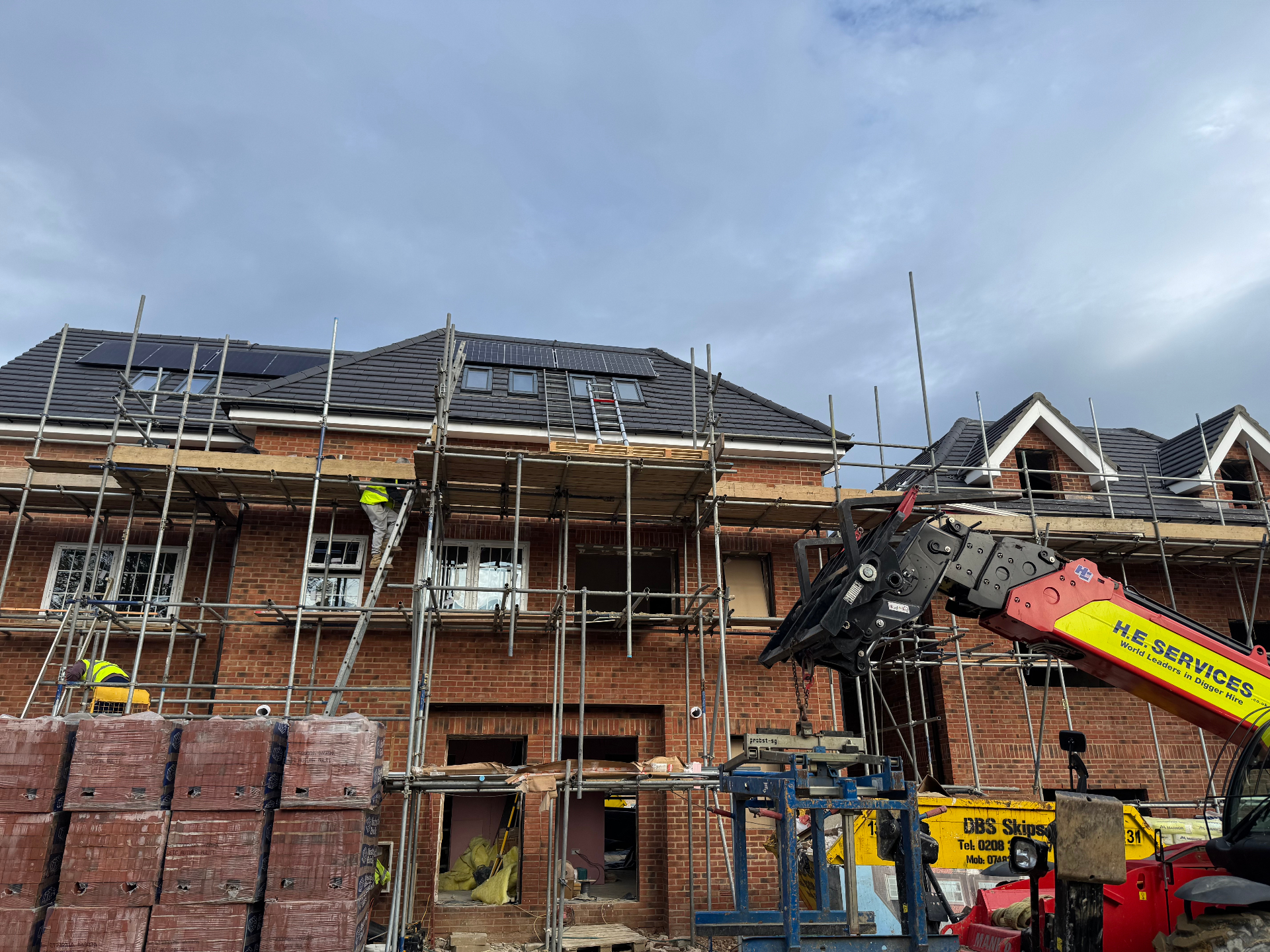 New build development with rooftop solar PV install in progress